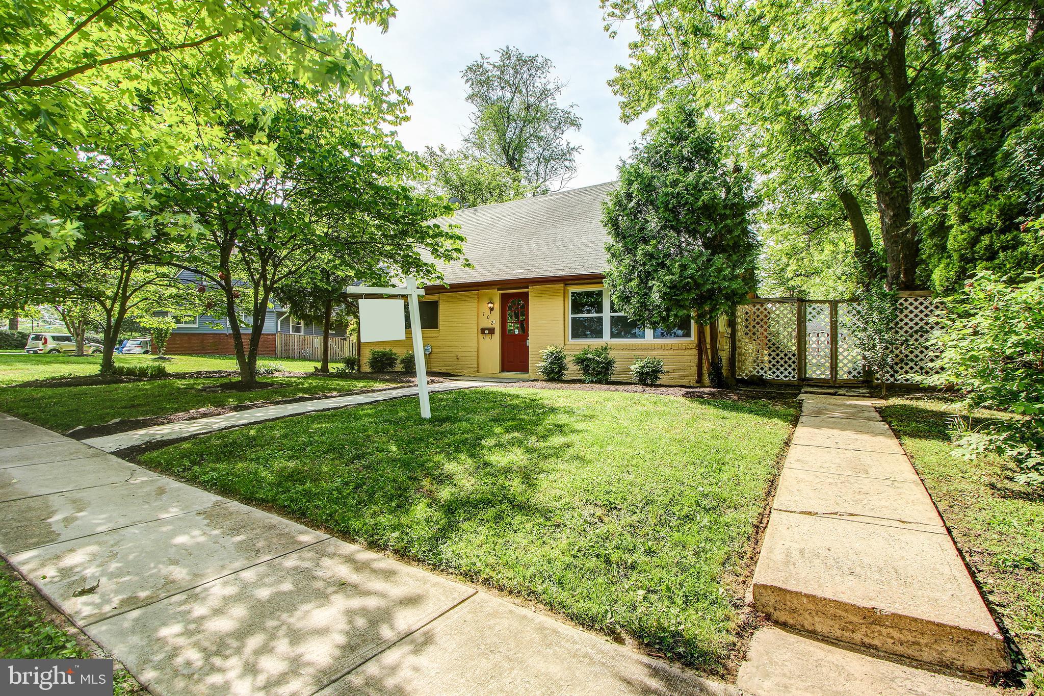 702 Dryden Street Silver Spring, MD 20901 - Photo 25 of 31 a front view of a house with a yard and trees