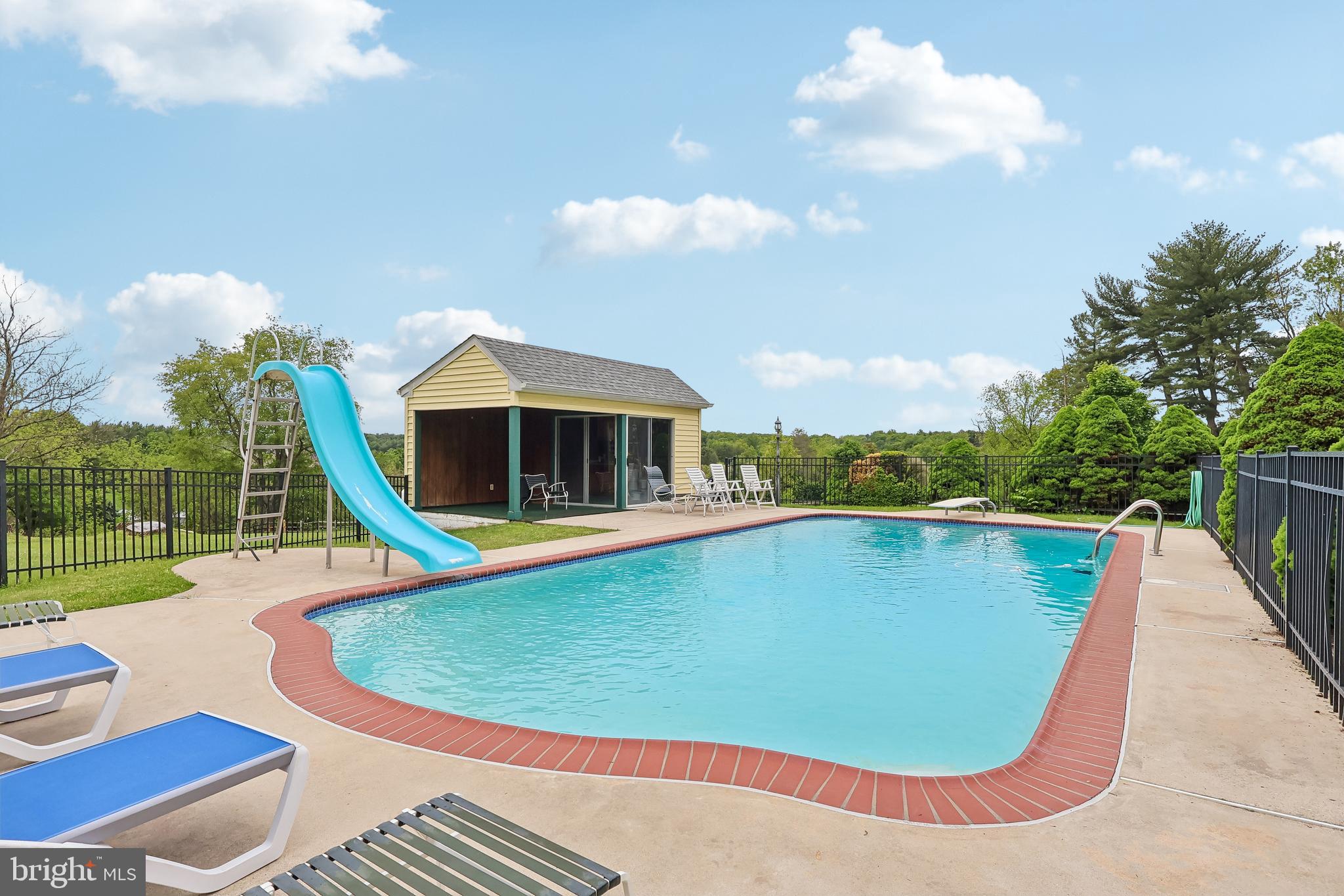 983 Palmers Mill Road Media, PA 19063 - Photo 57 of 83 Pool with water slide and diving board.