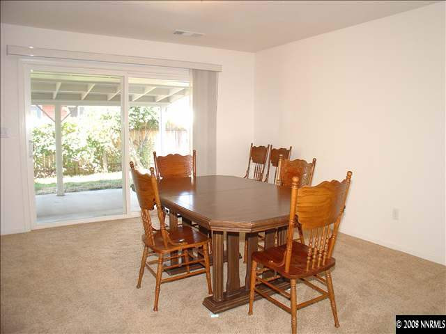 701 Keele Drive Reno, NV 89509 - Photo 3 of 8 a view of a dining room with furniture window and outside view