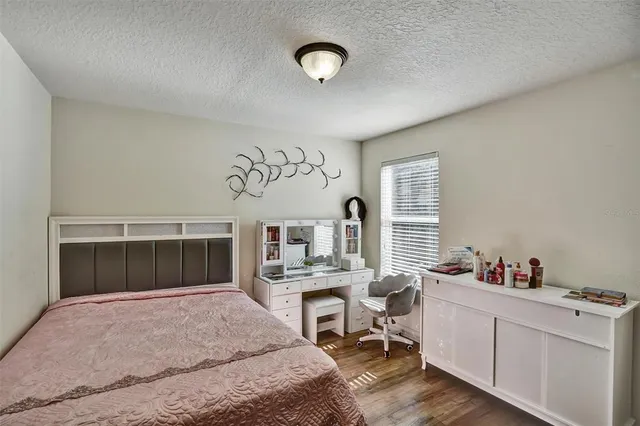 a bedroom with furniture and a fireplace