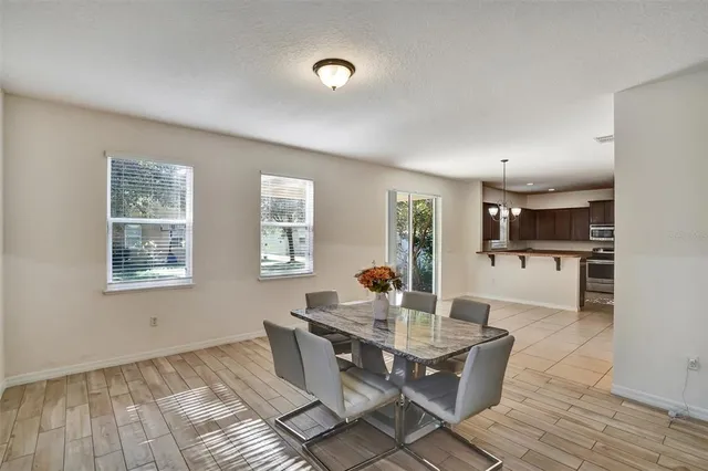 a dining room with furniture and window