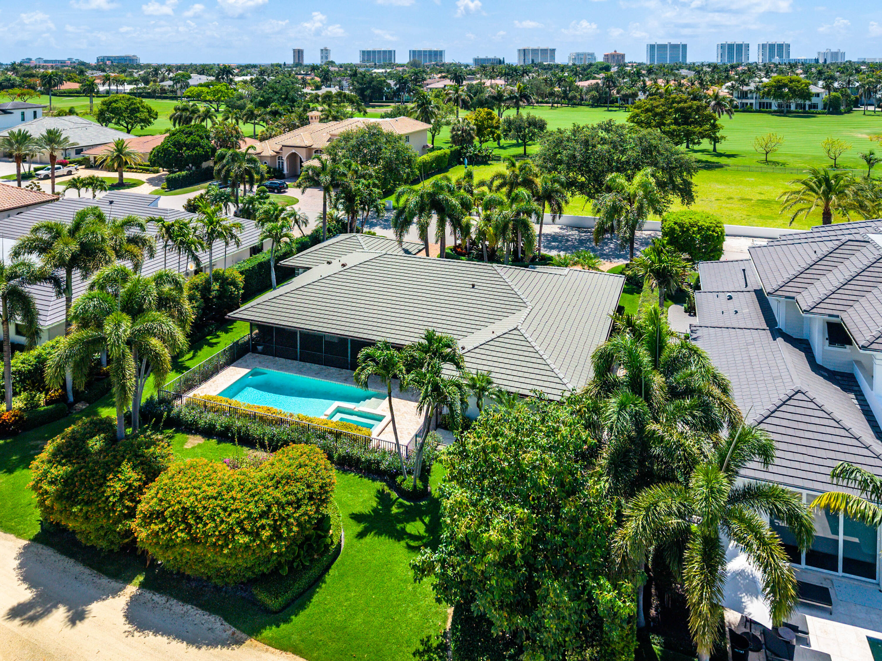 1851 Thatch Palm Drive Boca Raton, FL 33432 - Photo 65 of 70 an aerial view of a house with a garden and lake view