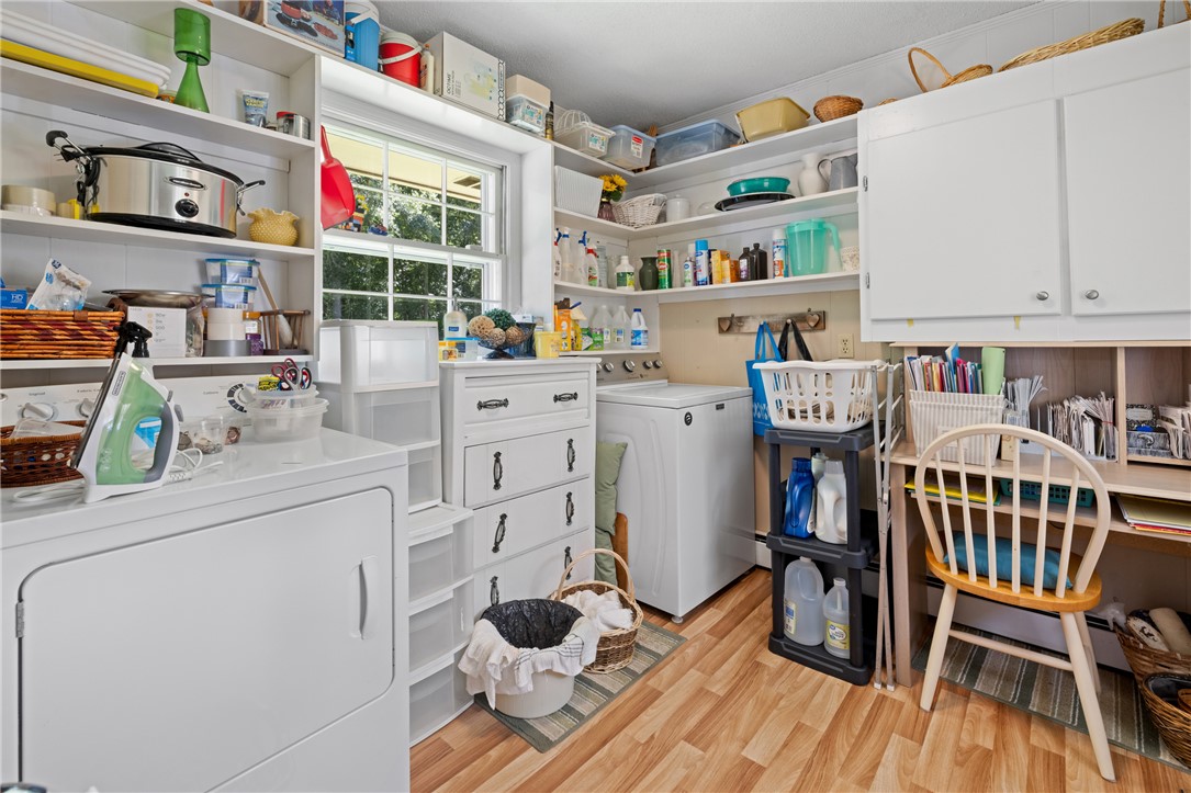 706 Pinewood Drive Pendleton, SC 29670 - Photo 11 of 35 Functional laundry room equipped with essential appliances and convenient storage solutions.