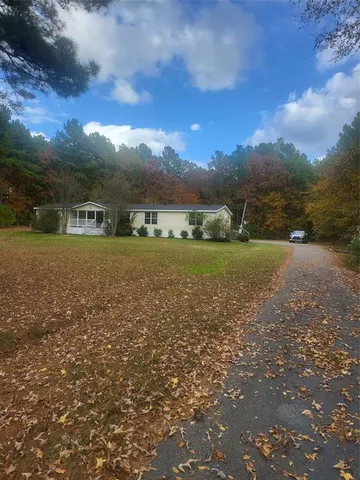 a view of a big yard with a house