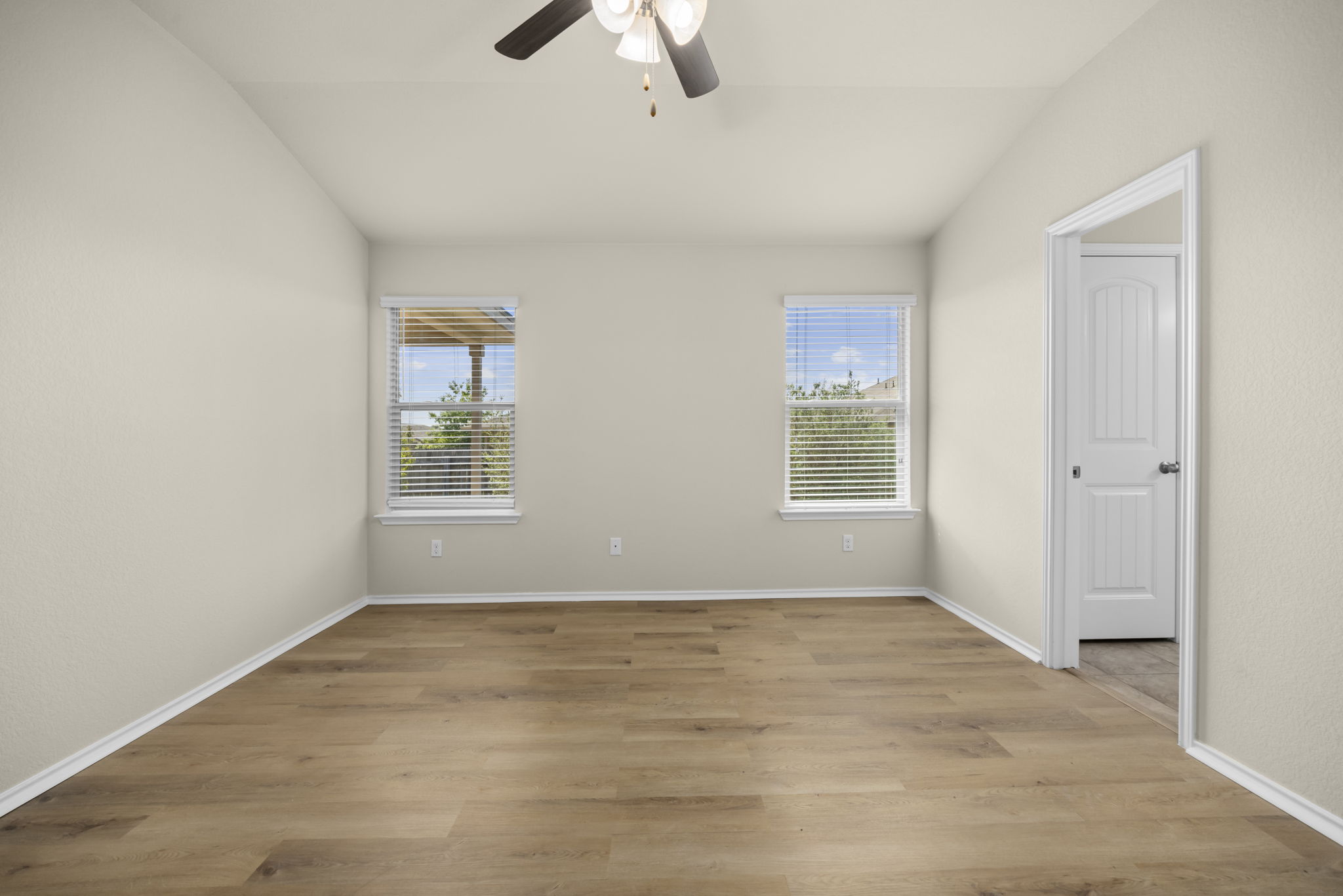 101 Plata Lane Jarrell, TX 76537 - Photo 23 of 27 an empty room with windows and fan
