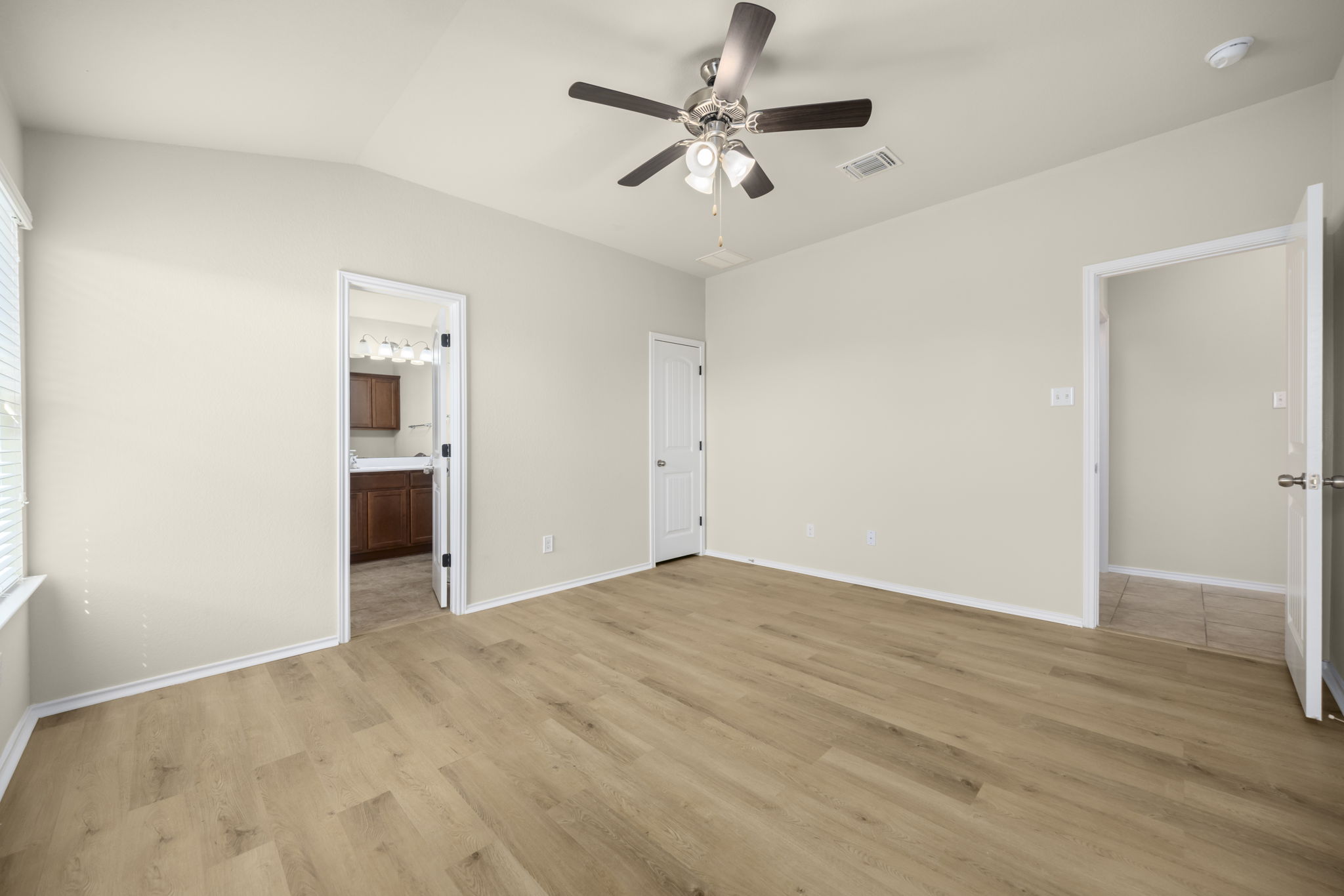 101 Plata Lane Jarrell, TX 76537 - Photo 24 of 27 an empty room with fan and windows