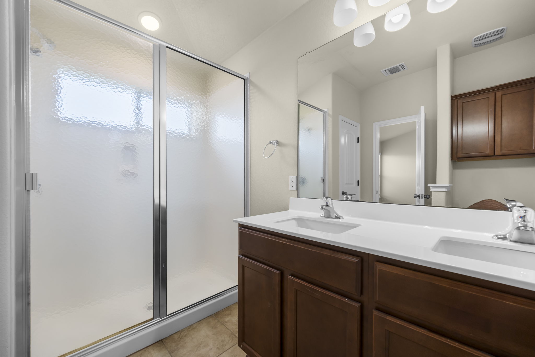 101 Plata Lane Jarrell, TX 76537 - Photo 25 of 27 a bathroom with a sink and a mirror