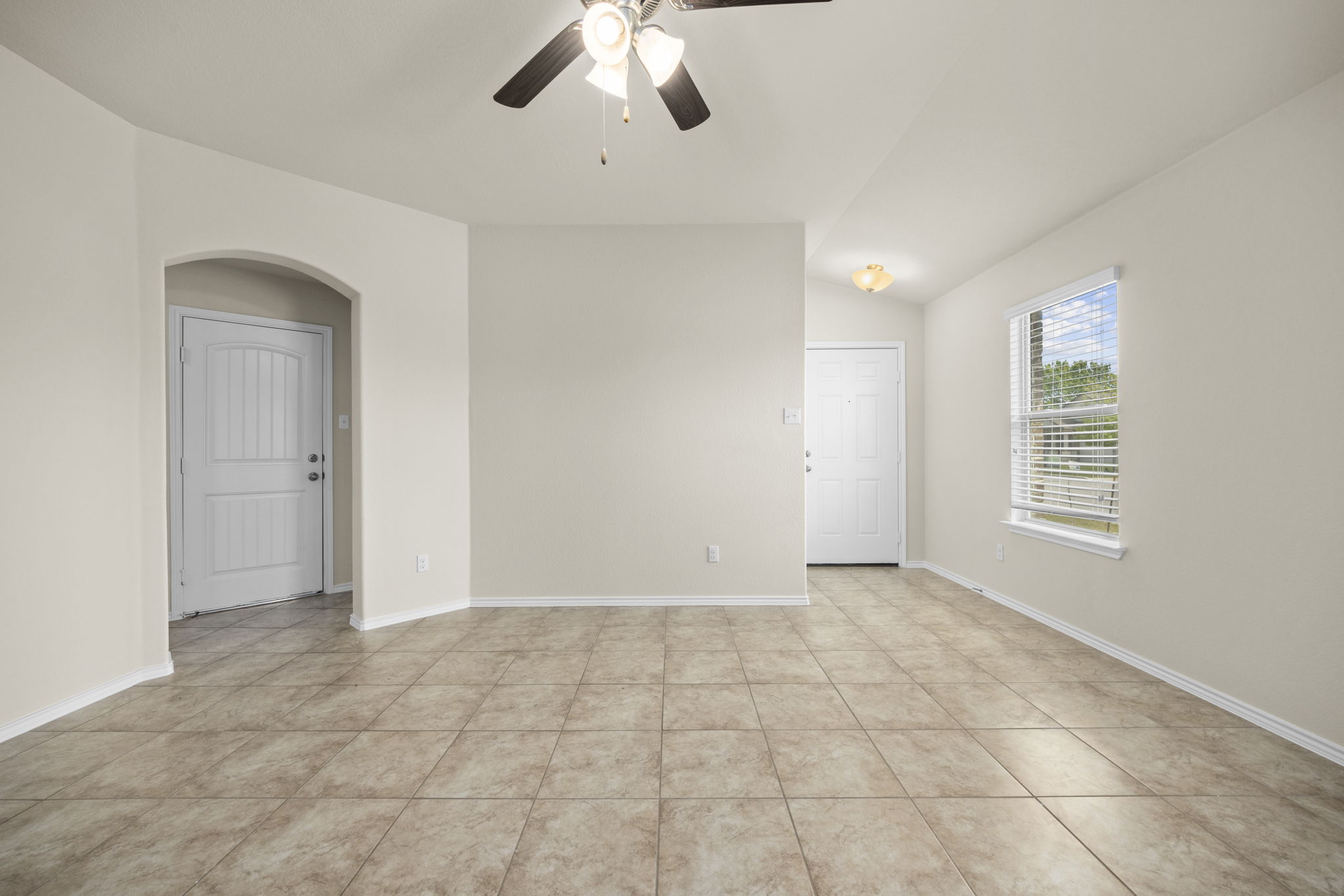 101 Plata Lane Jarrell, TX 76537 - Photo 4 of 27 a view of an empty room with a window