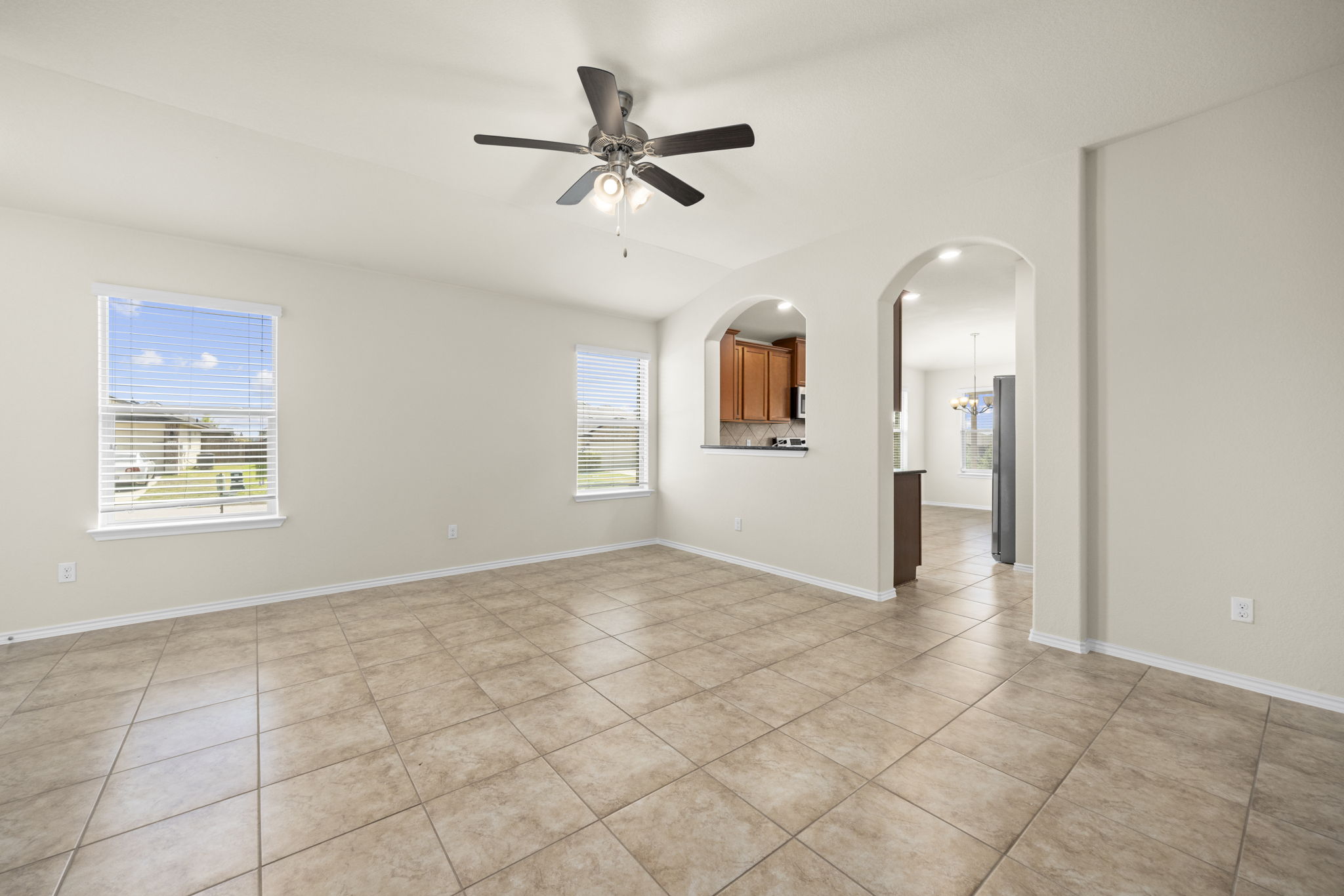 101 Plata Lane Jarrell, TX 76537 - Photo 6 of 27 a view of a livingroom with a ceiling fan and window