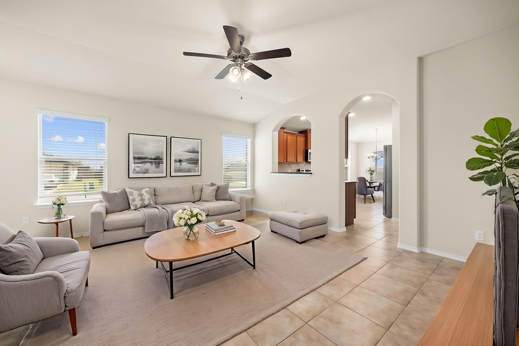 101 Plata Lane Jarrell, TX 76537 - Photo 7 of 27 a living room with furniture a ceiling fan a rug and a window