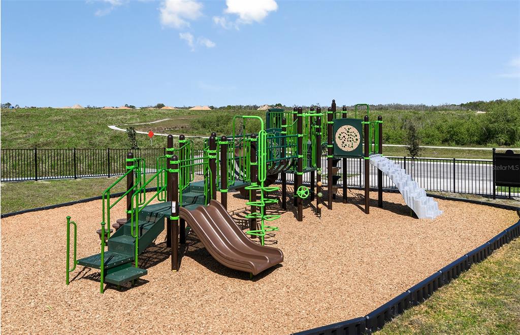 1730 Ruby Ln Lake Lake Alfred, FL 33850 - Photo 21 of 26 a view of a swimming pool with a patio and a garden