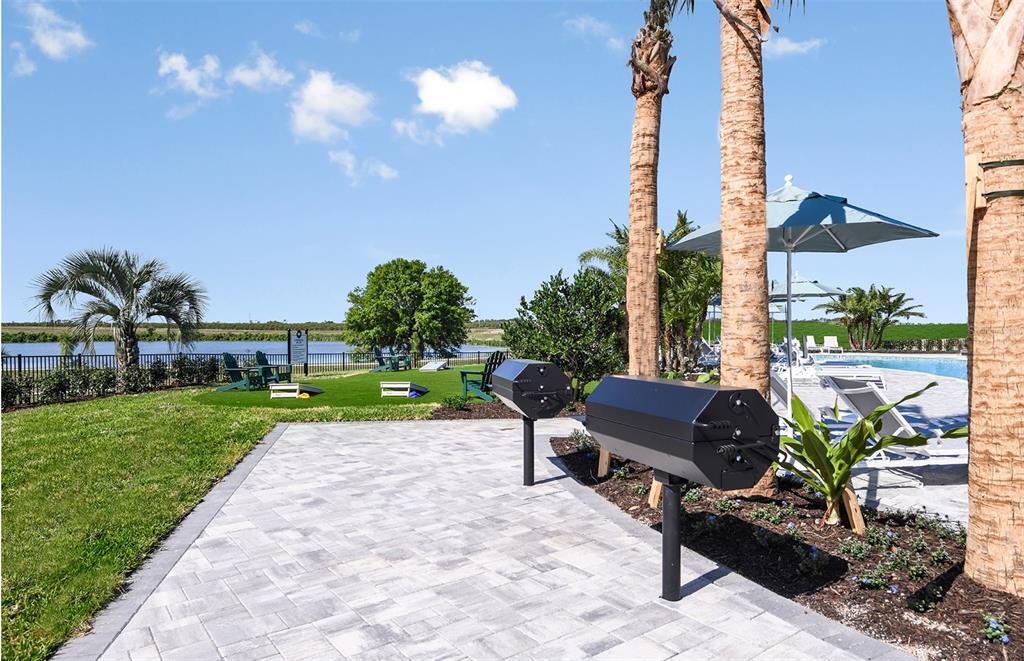 1730 Ruby Ln Lake Lake Alfred, FL 33850 - Photo 22 of 26 a view of a table and chairs in patio and a yard