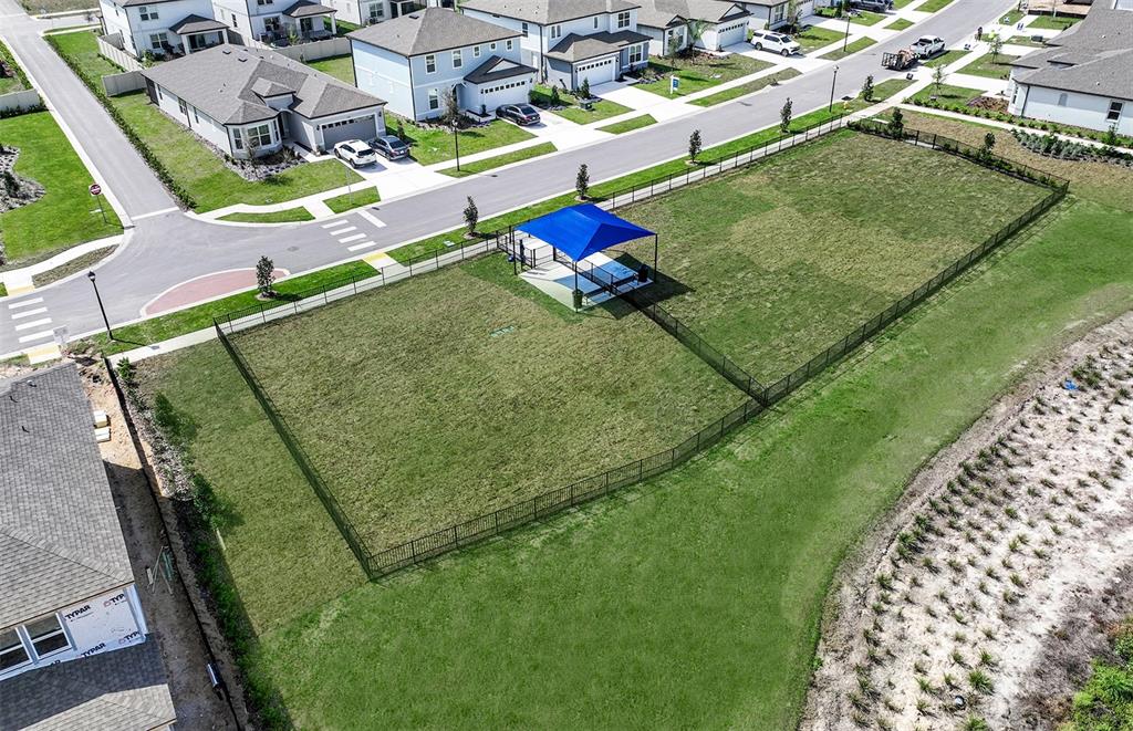 1730 Ruby Ln Lake Lake Alfred, FL 33850 - Photo 23 of 26 an aerial view of a tennis ground with large trees