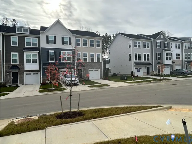 a front view of residential houses with street