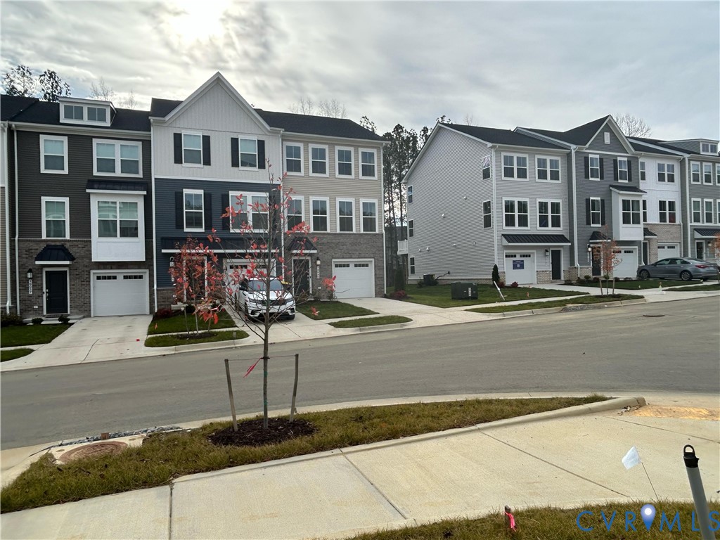 16040 Abelson Way, Unit 16040 Chesterfield, VA 23832 - Photo 4 of 20 a front view of residential houses with street