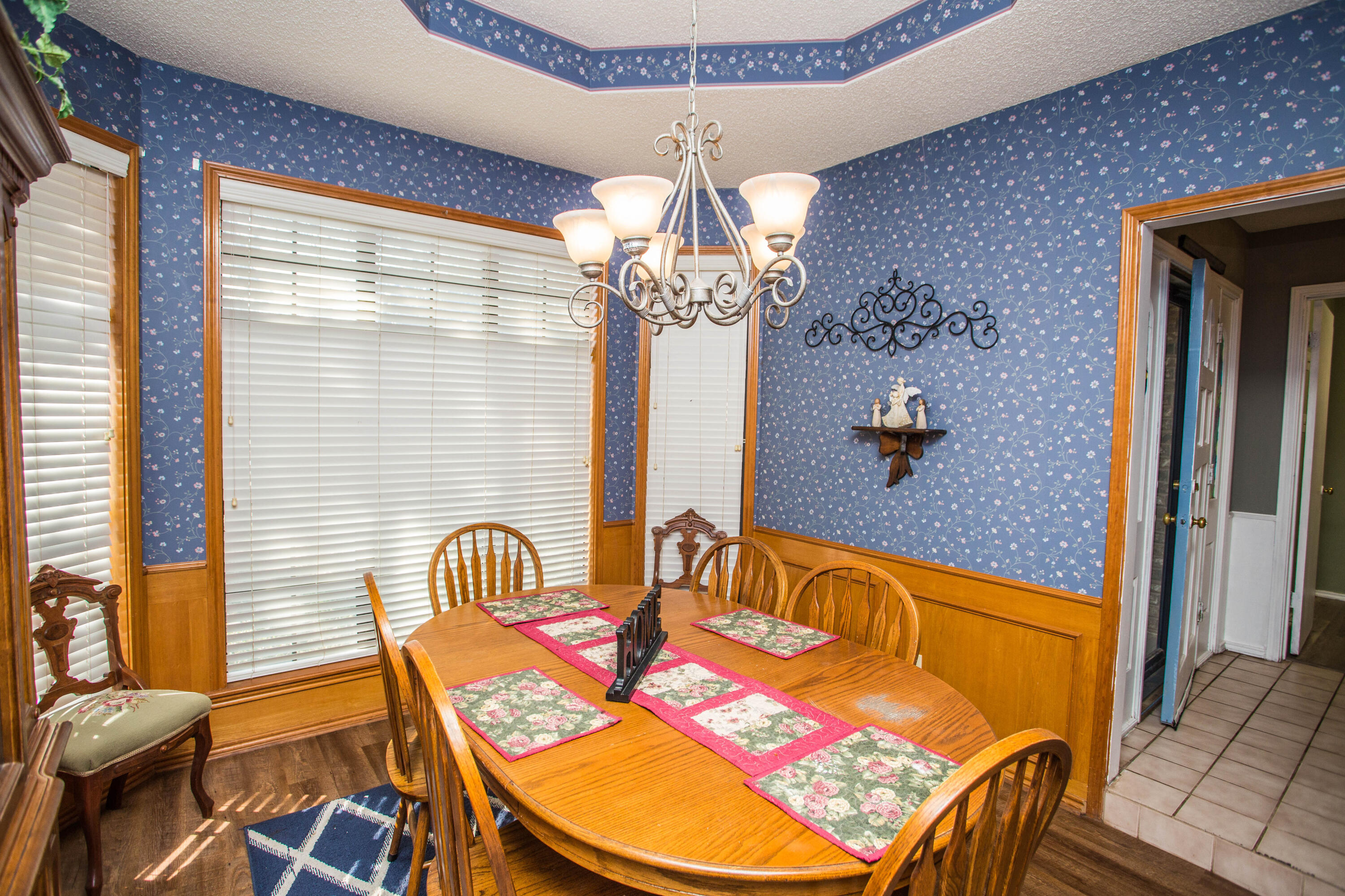 6030 72nd Street Lubbock, TX 79424 - Photo 11 of 33 a view of a dining room with furniture and chandelier