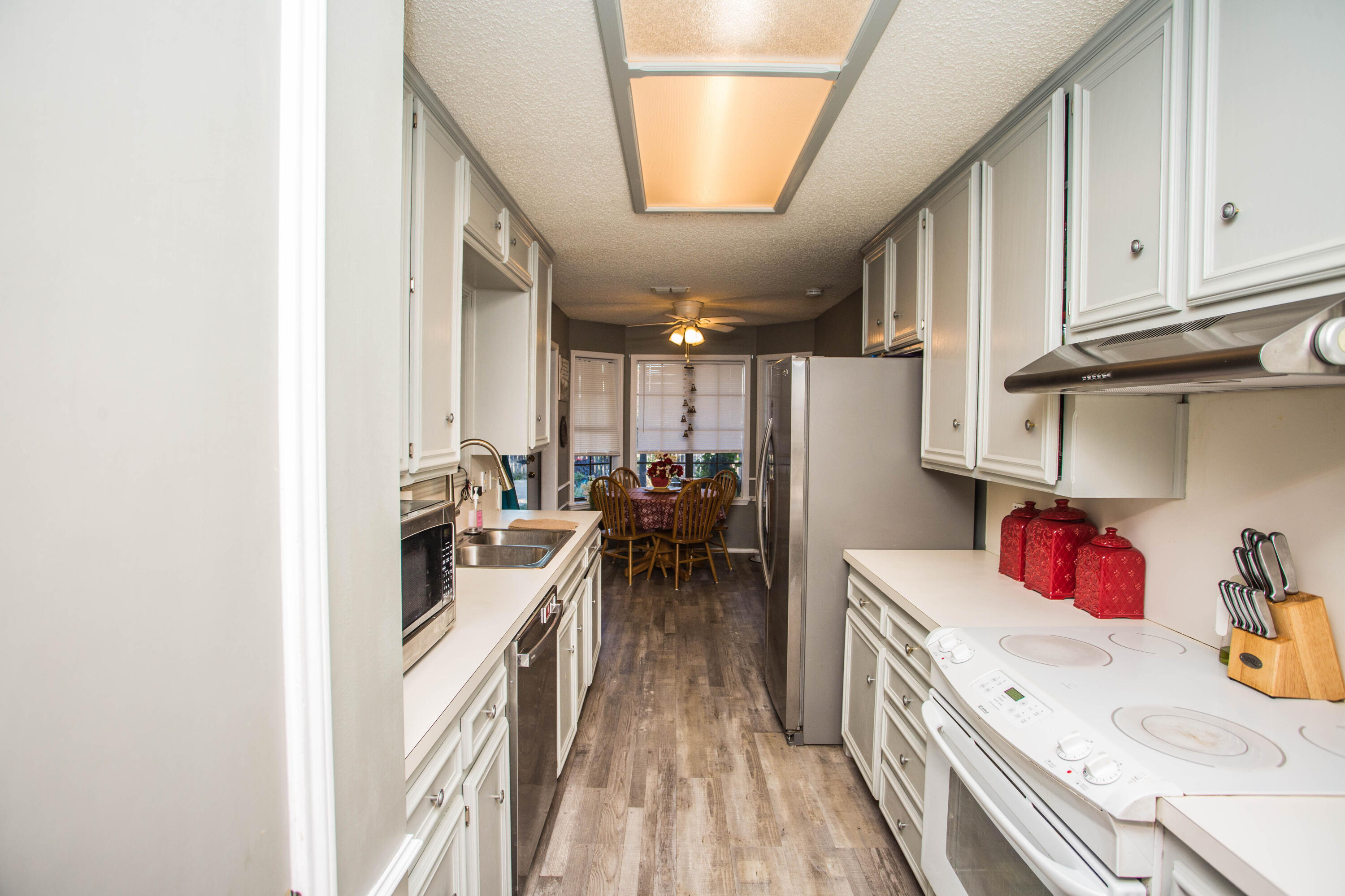 6030 72nd Street Lubbock, TX 79424 - Photo 14 of 33 a kitchen with a table and chairs