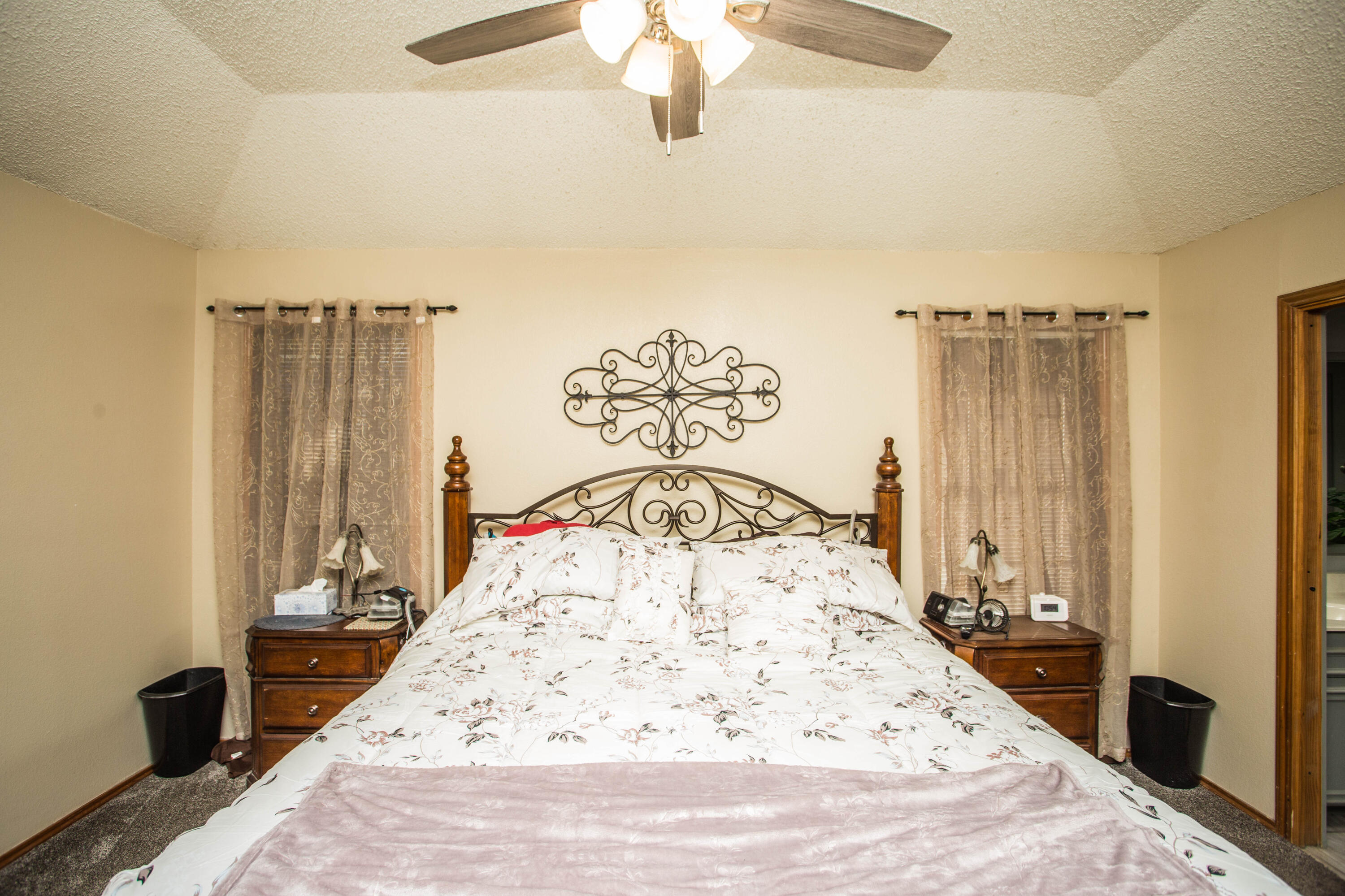 6030 72nd Street Lubbock, TX 79424 - Photo 16 of 33 a view of a bedroom with wooden floor and bedroom