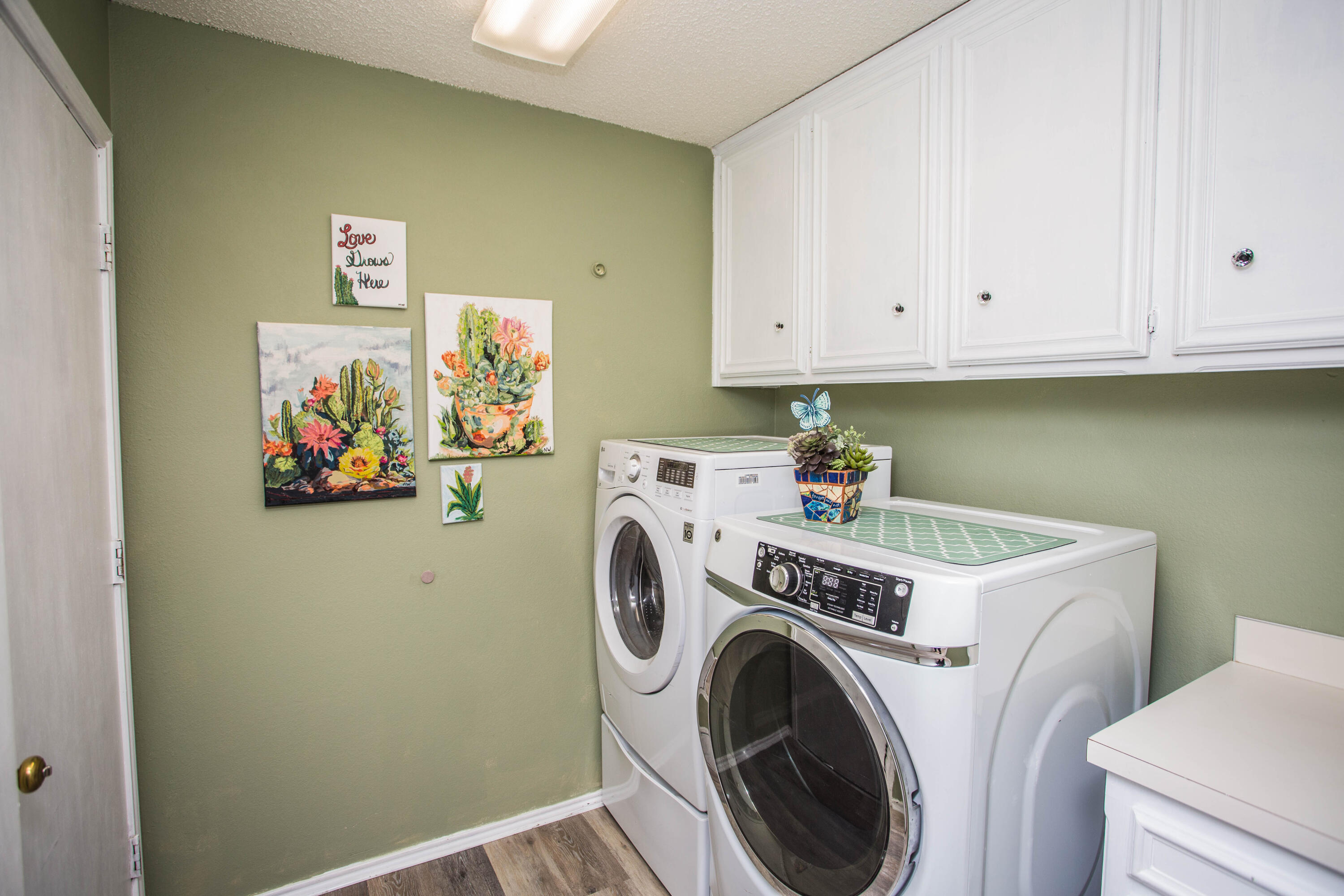 6030 72nd Street Lubbock, TX 79424 - Photo 26 of 33 a view of storage and utility room with washer and dryer