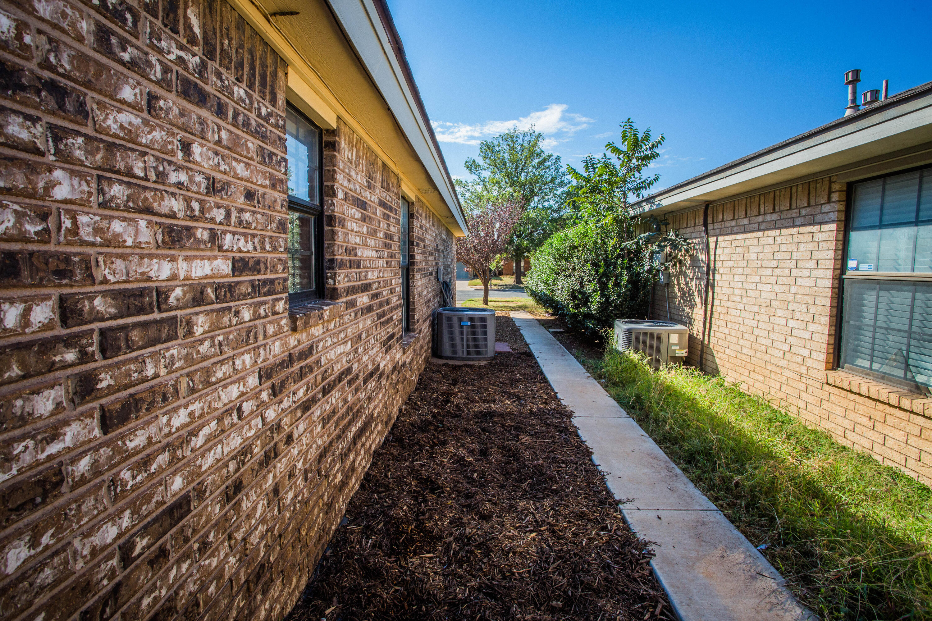 6030 72nd Street Lubbock, TX 79424 - Photo 33 of 33 a view of a pathway with a house