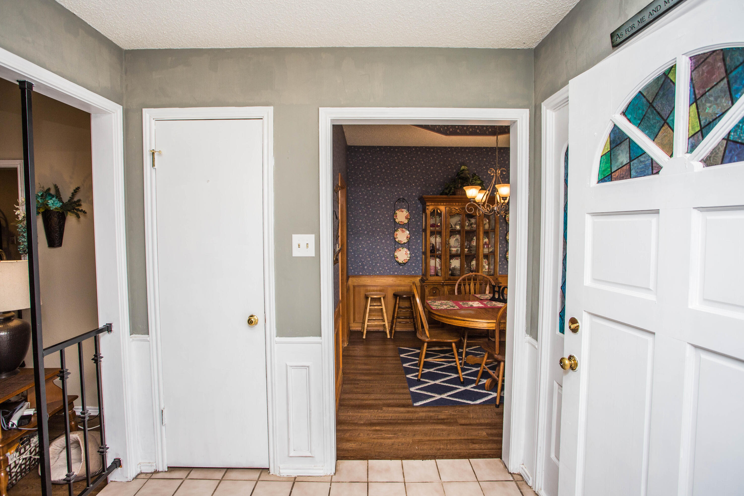 6030 72nd Street Lubbock, TX 79424 - Photo 6 of 33 a view of a hallway with wooden floor and windows