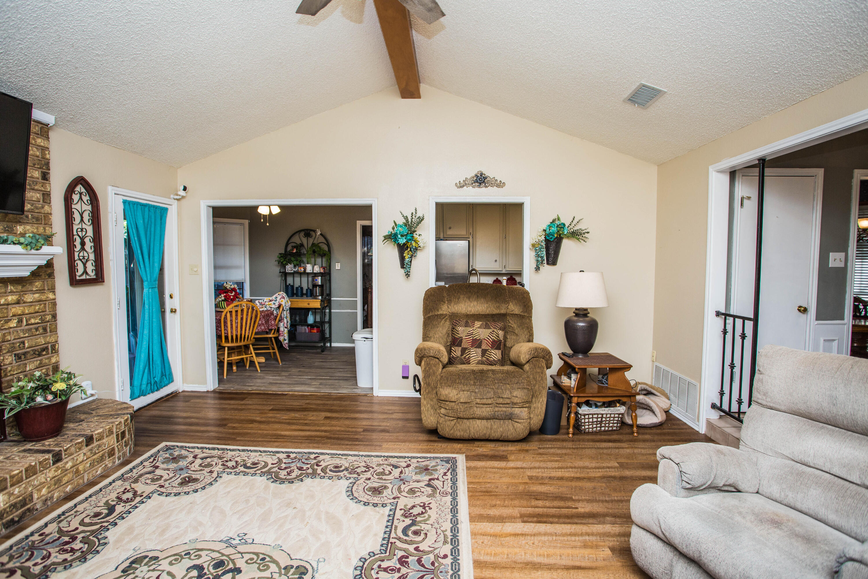 6030 72nd Street Lubbock, TX 79424 - Photo 9 of 33 a living room with furniture and wooden floor