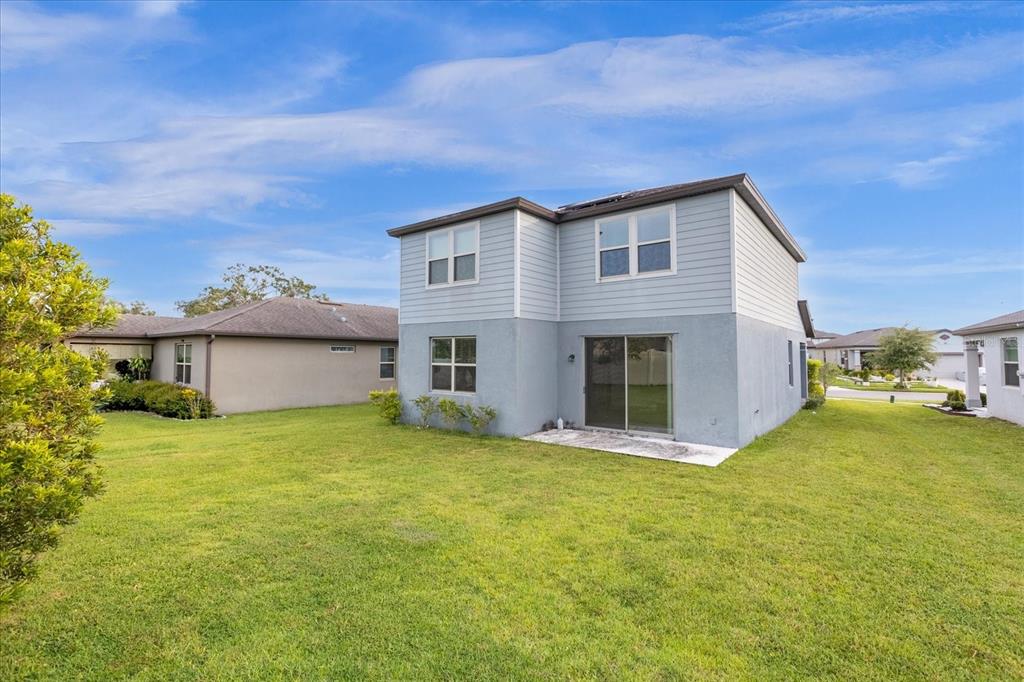 3504 Southern Cross Loop Kissimmee, FL 34744 - Photo 27 of 27 a view of a house with a yard