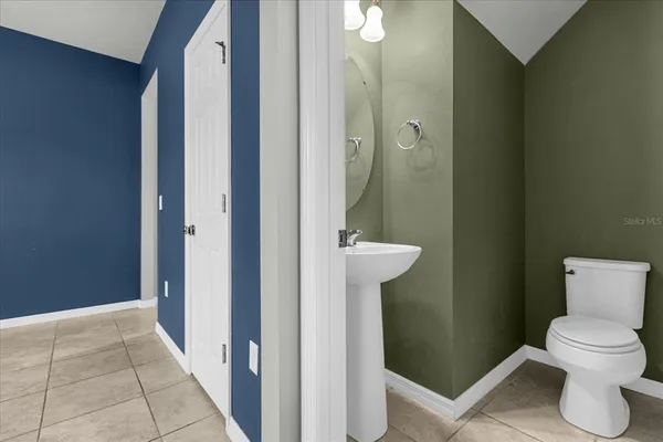 a bathroom with a toilet and a sink