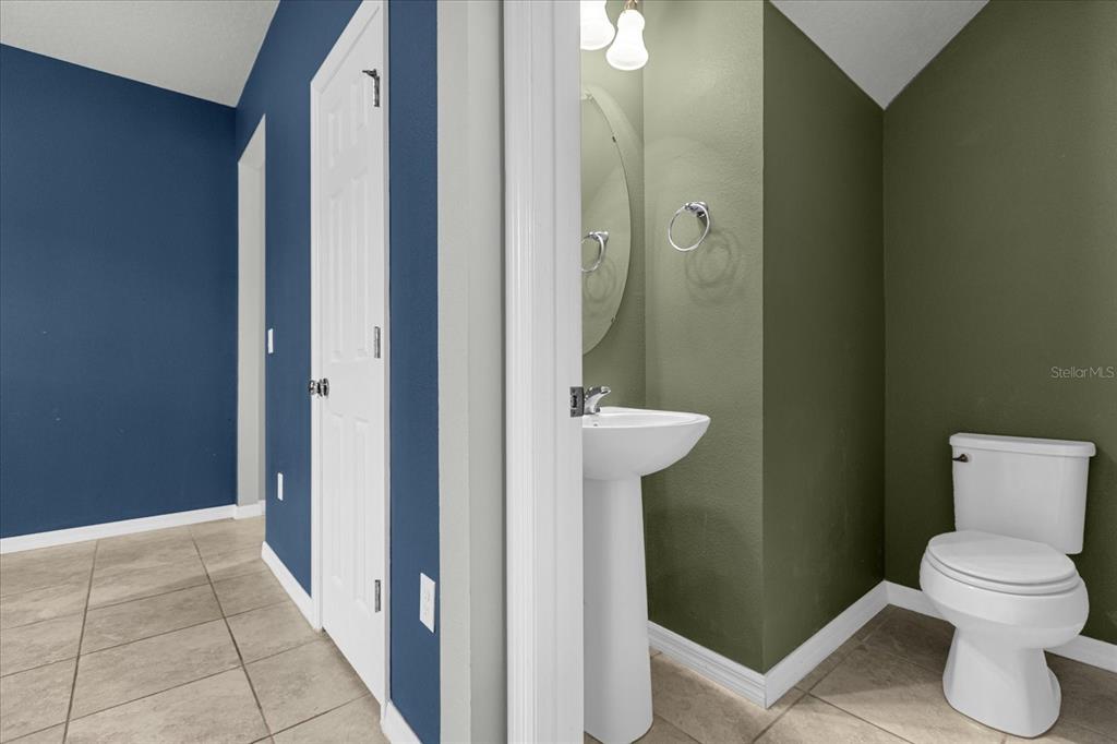 3504 Southern Cross Loop Kissimmee, FL 34744 - Photo 8 of 27 a bathroom with a toilet and a sink