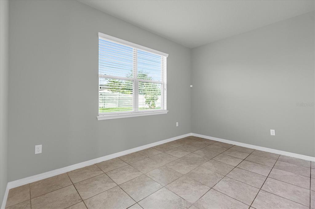 3504 Southern Cross Loop Kissimmee, FL 34744 - Photo 10 of 27 an empty room with a window