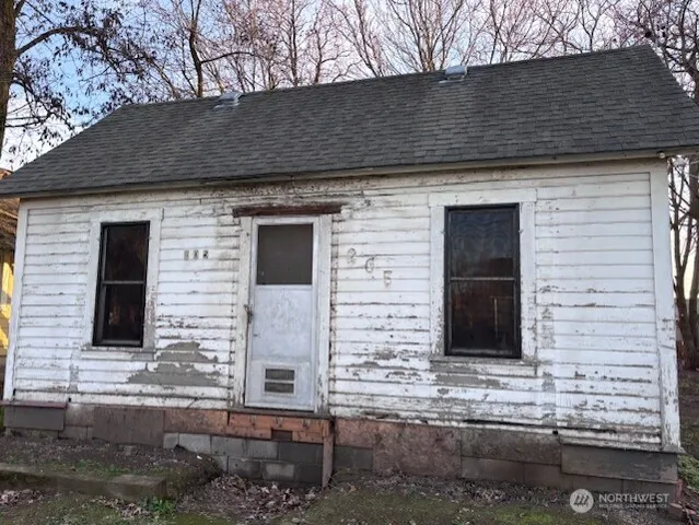 a front view of a house with stairs