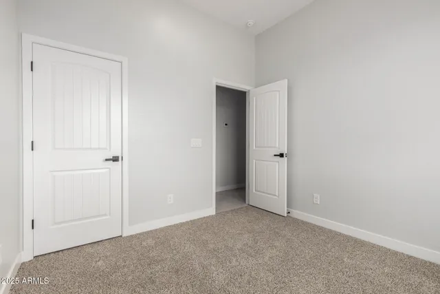 an empty room with closet area