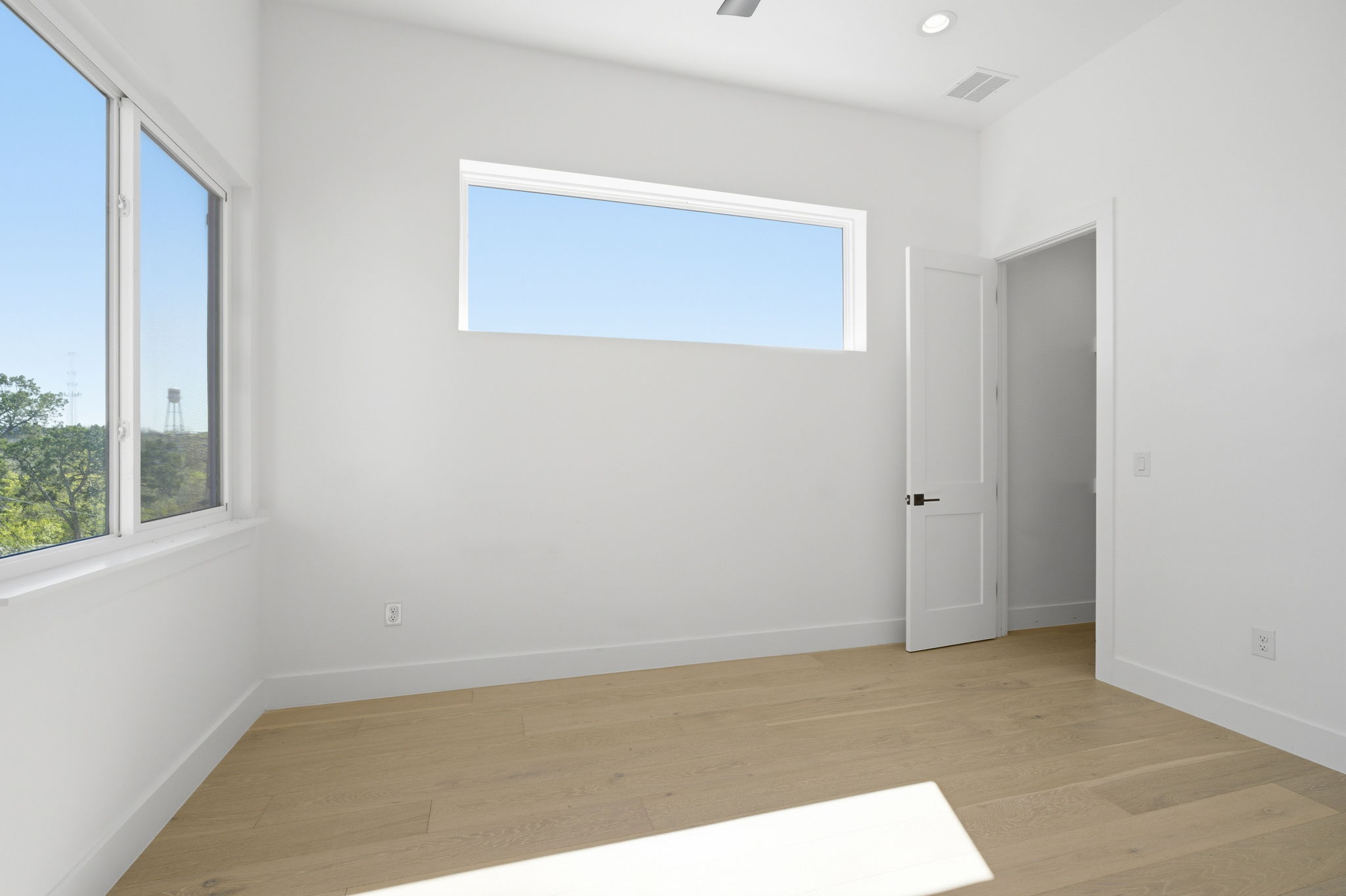 400 Post Rd Drive Austin, TX 78704 - Photo 18 of 23 Empty room featuring light wood finished floors and recessed lighting