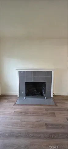 a living room with a fireplace and a fireplace