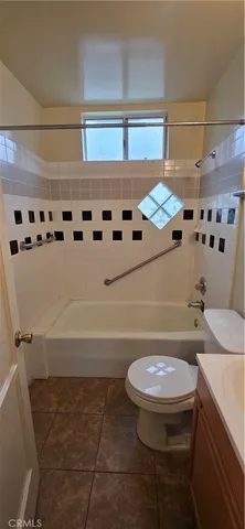 a bathroom with a sink a toilet and a shower
