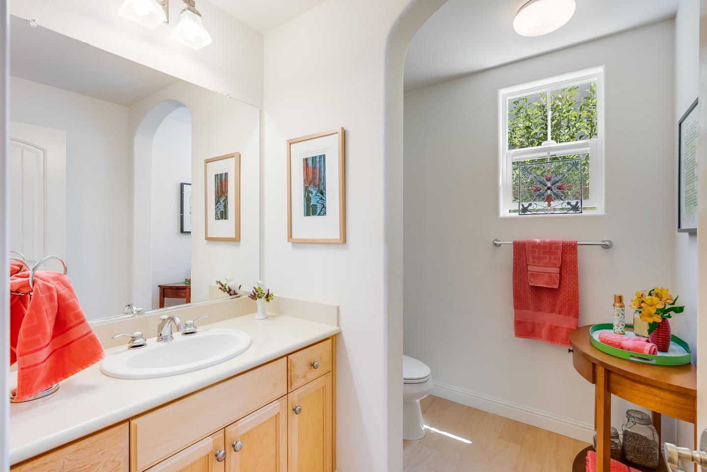 7680 MacKenzie Way Gilroy, CA 95020 - Photo 16 of 61 a bathroom with a sink mirror vanity and a toilet