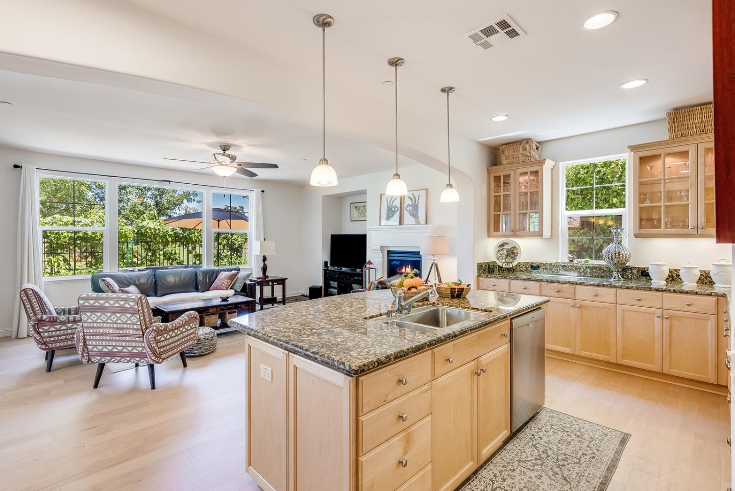 7680 MacKenzie Way Gilroy, CA 95020 - Photo 20 of 61 a living room with granite countertop kitchen island furniture and a large window
