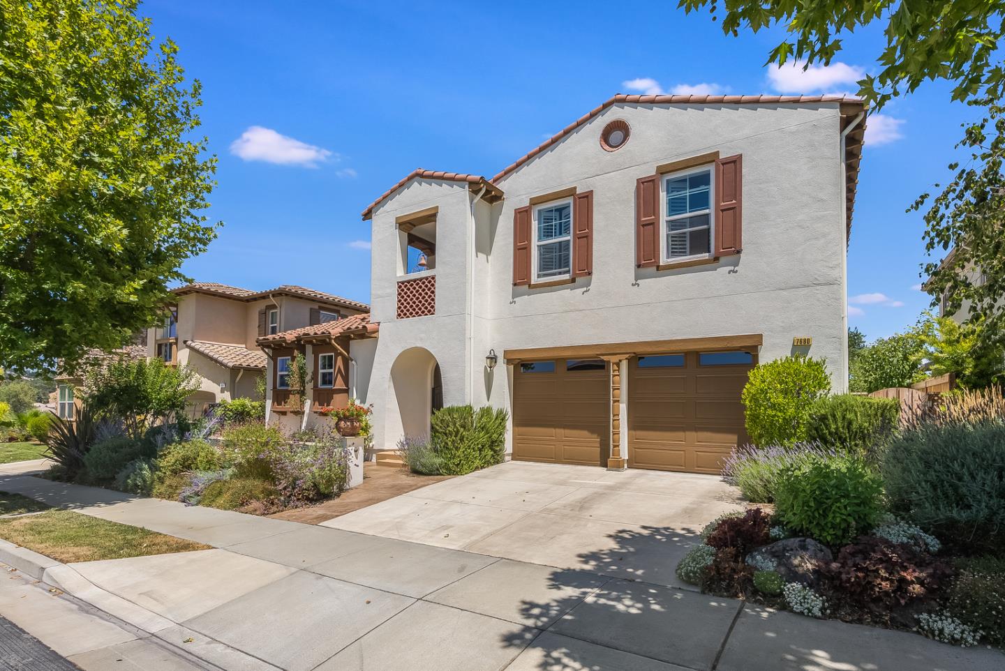 7680 MacKenzie Way Gilroy, CA 95020 - Photo 2 of 61 a front view of a house with a yard and garage