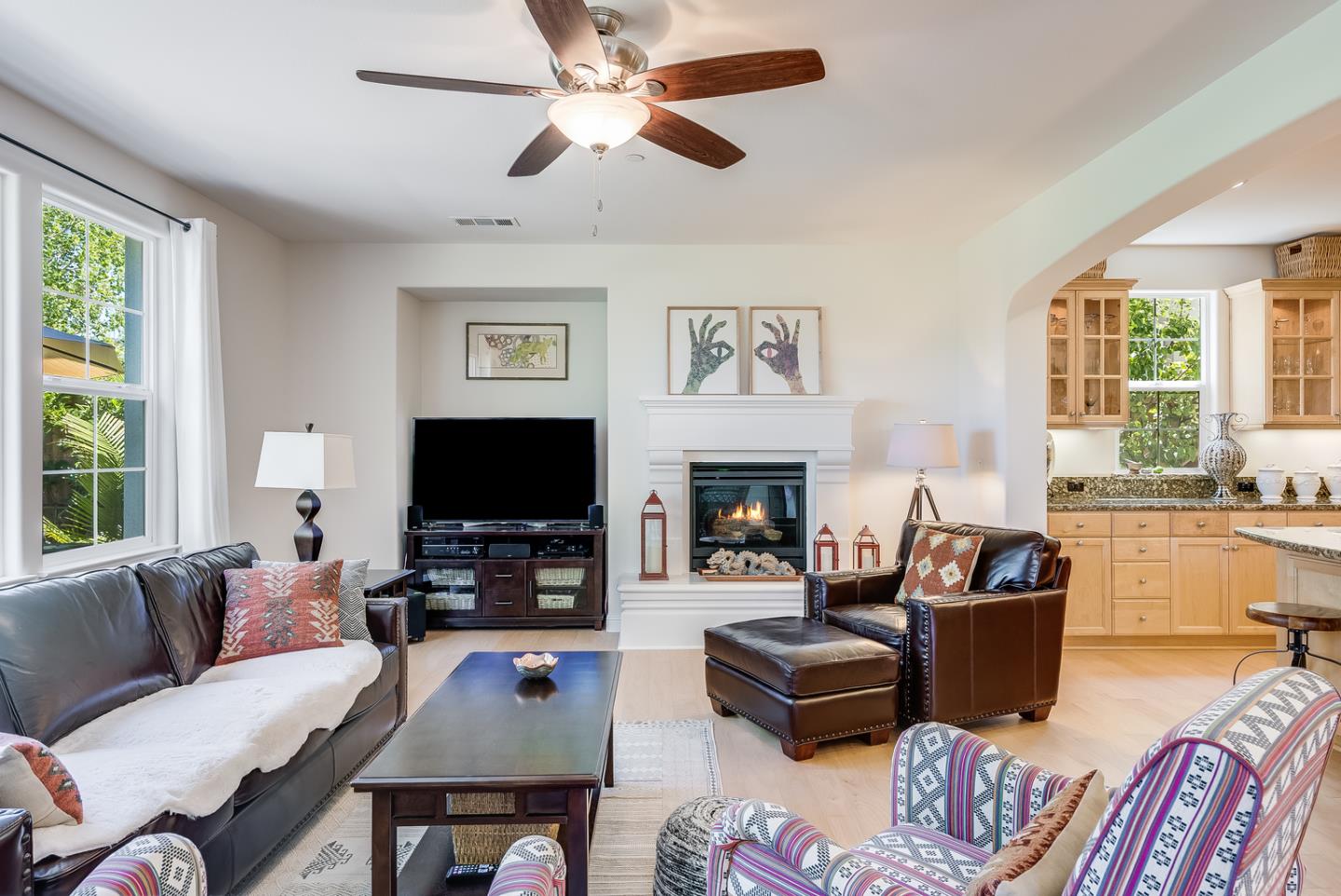 7680 MacKenzie Way Gilroy, CA 95020 - Photo 25 of 61 a living room with furniture a flat screen tv and a large window