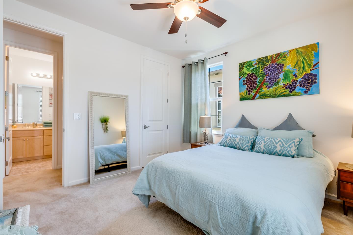 7680 MacKenzie Way Gilroy, CA 95020 - Photo 29 of 61 a bedroom with a bed and a painting on the wall