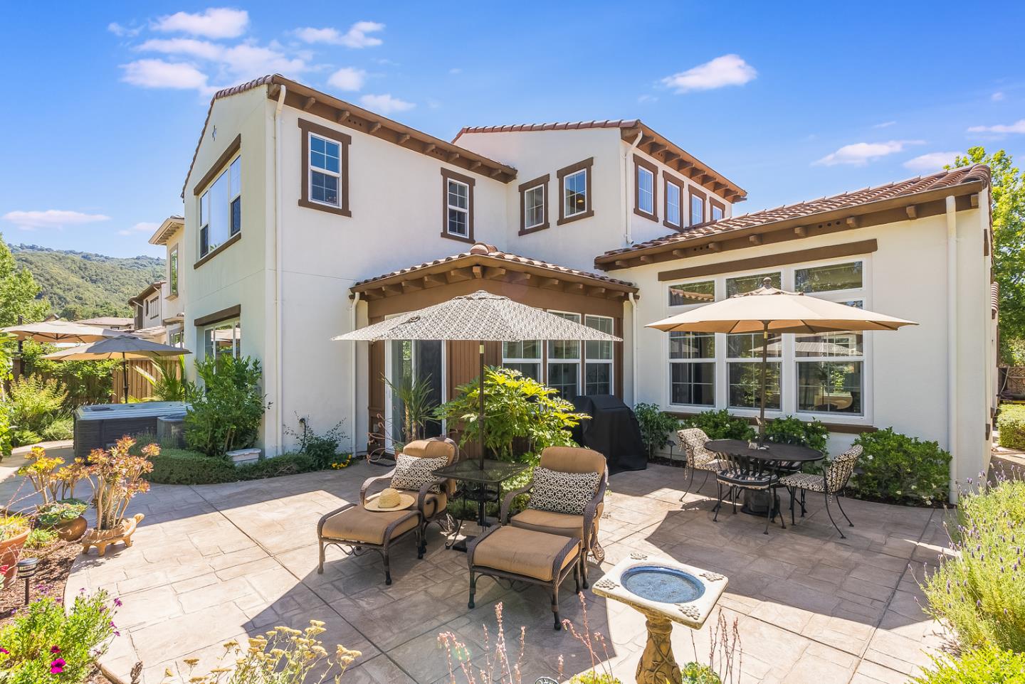 7680 MacKenzie Way Gilroy, CA 95020 - Photo 43 of 61 a view of a patio with couches table and chairs and potted plants