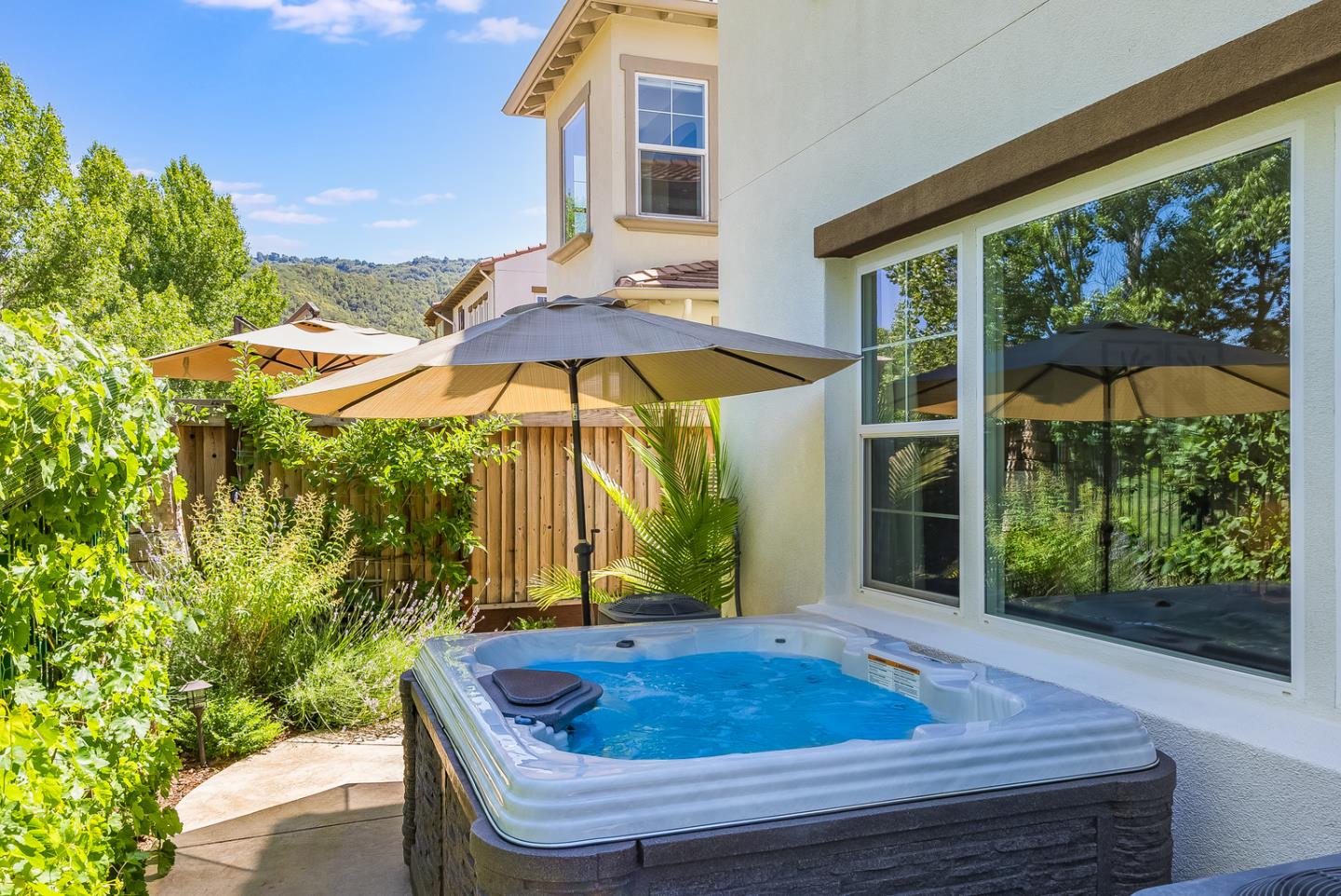7680 MacKenzie Way Gilroy, CA 95020 - Photo 44 of 61 a view of house with backyard and outdoor seating