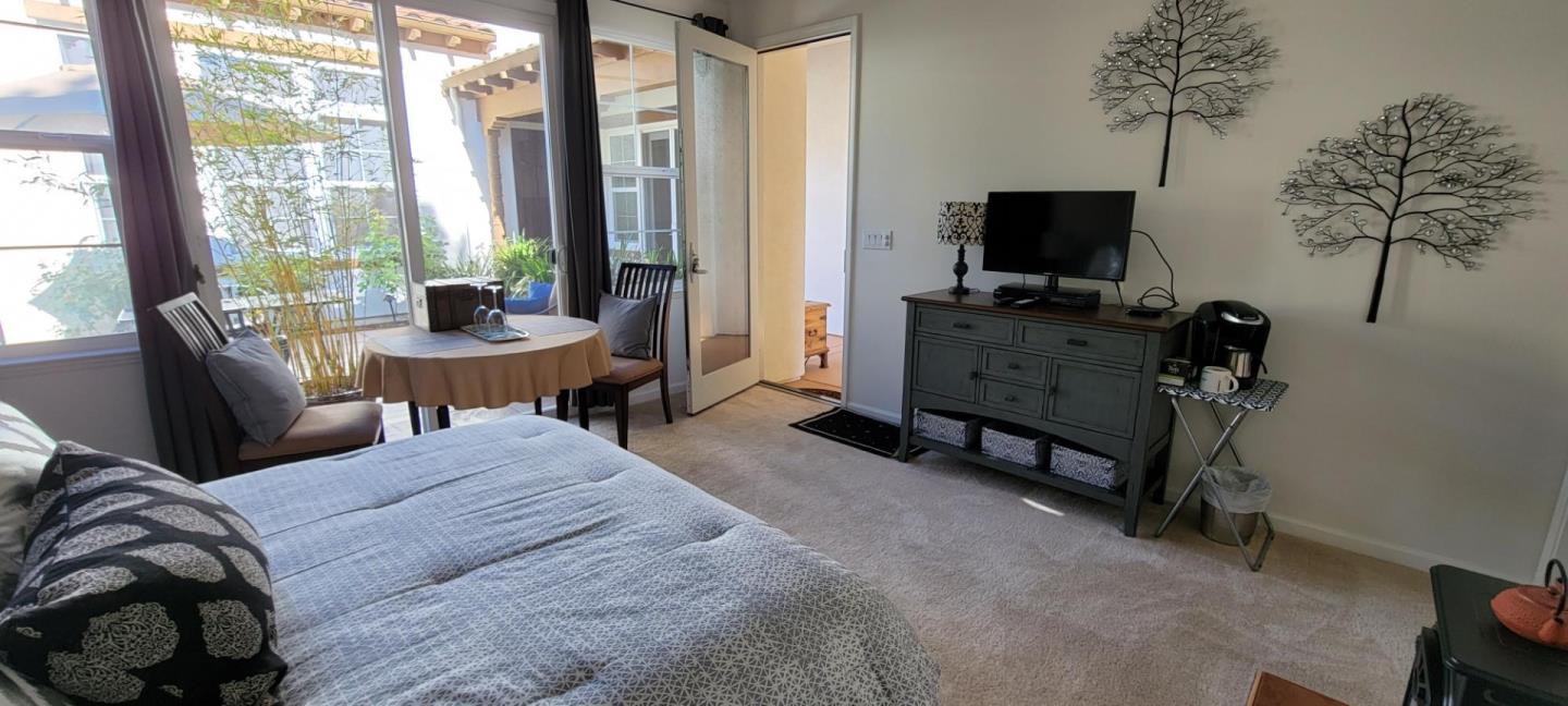 7680 MacKenzie Way Gilroy, CA 95020 - Photo 48 of 61 a bedroom with a bed and large windows