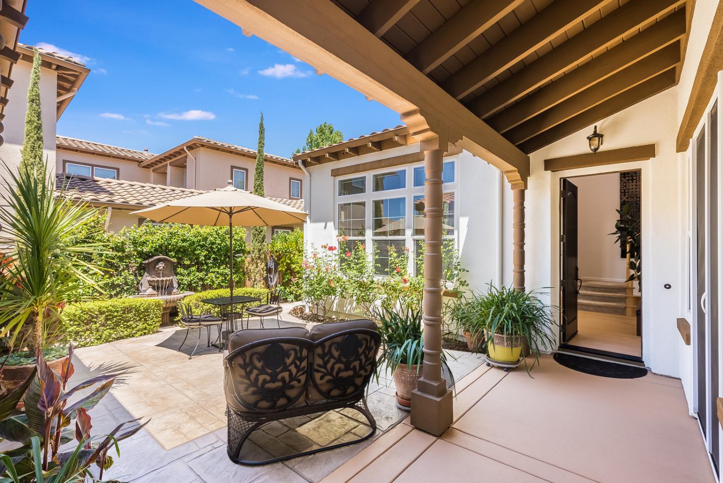 7680 MacKenzie Way Gilroy, CA 95020 - Photo 6 of 61 a building outdoor space with patio furniture and potted plants