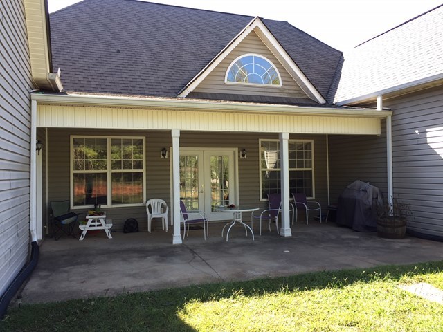 409 Torbet Road, Unit 1A1 Forsyth, GA 31029 - Photo 22 of 29 a front view of a house with outdoor seating
