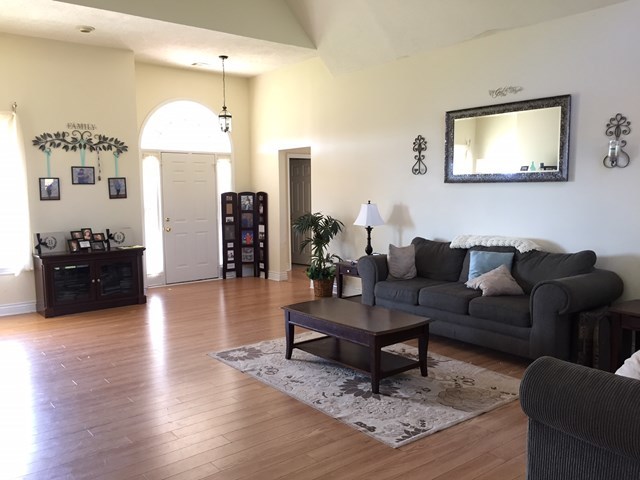 409 Torbet Road, Unit 1A1 Forsyth, GA 31029 - Photo 4 of 29 a living room with furniture and wooden floor