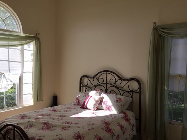409 Torbet Road, Unit 1A1 Forsyth, GA 31029 - Photo 5 of 29 a bedroom with a bed and large window