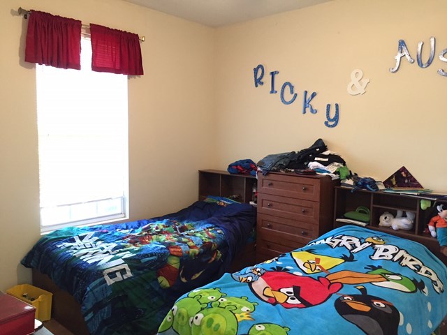 409 Torbet Road, Unit 1A1 Forsyth, GA 31029 - Photo 7 of 29 a bedroom with a bed and dresser
