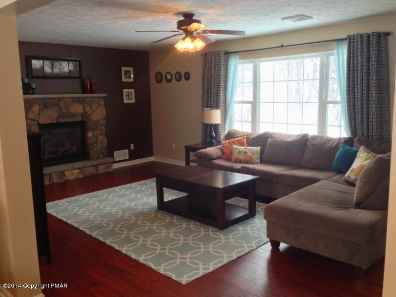 1148 Sunside Road Long Pond, PA 18334 - Photo 11 of 20 a living room with furniture and a flat screen tv