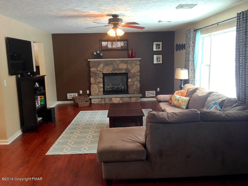 1148 Sunside Road Long Pond, PA 18334 - Photo 12 of 20 a living room with furniture and a fireplace